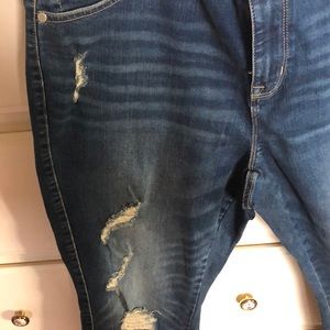 Distressed jeans never worn but without tags.